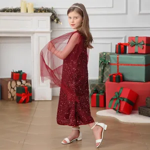 Detail of burgundy sleeveless sequin party dress for girls with red tulle capelet