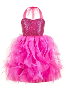 Macro shot of tiered ruffled tulle and sparkling sequins on fuchsia girl dress