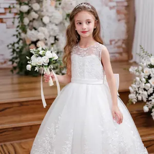 Detailed embroidery and multi-layer tulle on a white lace flower girl dress for weddings