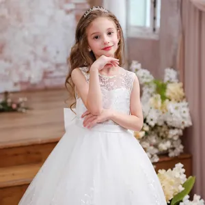 Exquisite white lace floral embroidery and sheer tulle neckline on a girl's gown