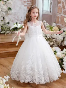 Detailed view of white floral lace bodice and layered tulle skirt on a girls princess dress