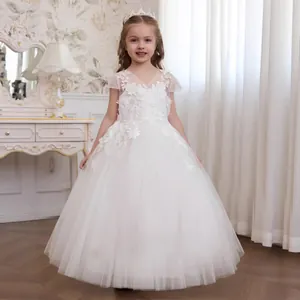 Close-up of white lace bodice and fluffy tulle layers on this elegant flower girl dress