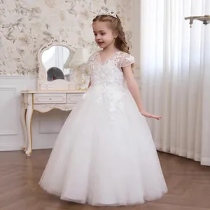 Elegant white lace and tulle flower girl dress with layered princess skirt details