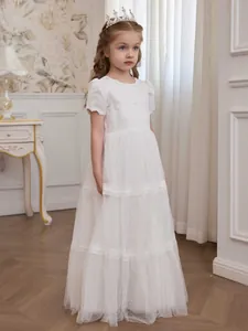 Elegant white lace flower girl dress with layered tulle skirt and puff sleeves for weddings