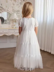 Elegant white lace flower girl dress with layered tulle skirt and puffy short sleeves