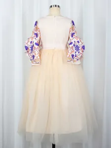 Detail view of the back zipper and floral bell sleeves on an Arabic girls' dress