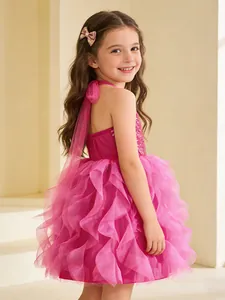 Girl's pink sequined princess dress with tiered tulle skirt and halter neck detail