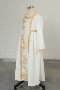 Detail of elegant white long-sleeved dress with gold embroidery and decorative woven trim