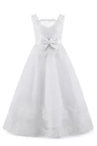 Detailed view of intricate lace bodice and satin bow on this white girl's princess dress