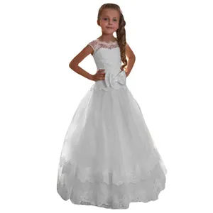 Detailed view of white lace bodice and fluffy tulle skirt with lace hem on a girl's gown