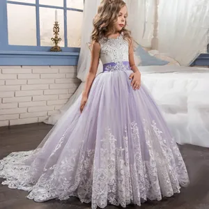 Detail of white lace embroidery and purple mesh skirt on a floral princess dress