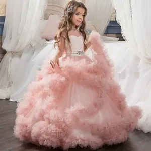 Detail of multi-layered pink tulle skirt with ruffled layers and a rhinestone flower belt