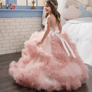 Detailed view of pink mesh tutu dress with tiered ruffles and a satin bow on the back