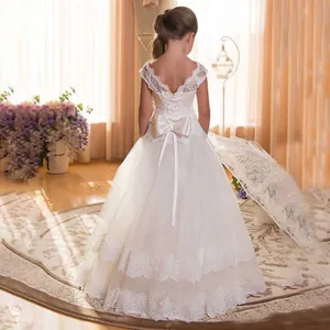 Elegant white lace flower girl dress with a large bow and open back for ball gowns