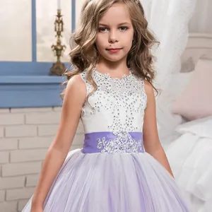 Detailed view of white lace bodice with sparkling silver sequins and purple mesh tulle skirt
