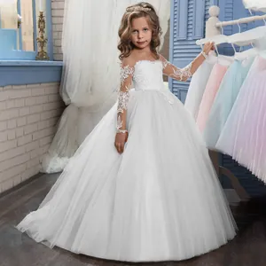 Close-up of white girls' tulle ball gown featuring intricate lace embroidery and long sleeves