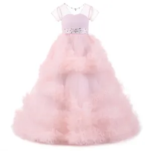 Close-up of pink flower girl dress with layered ruffles and rhinestone belt detail
