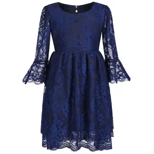 Detail of navy blue lace dress with flare sleeves and floral lace texture for girls