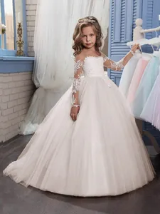 Ivory long-sleeved girls princess ball gown with lace bodice and layered tulle skirt