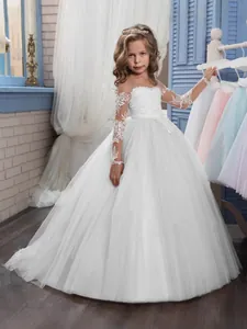 Elegant white lace flower girl dress with long illusion sleeves and tulle ball gown skirt
