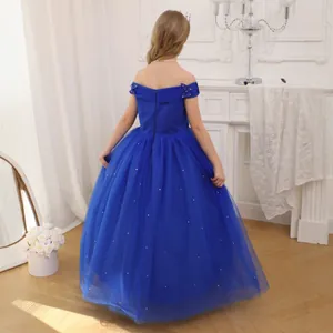 Detail of blue ball gown for girls featuring off-shoulder bows and sparkling tulle skirt