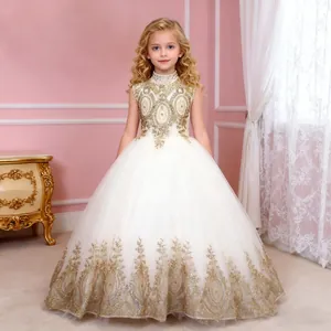 Exquisite close-up of gold floral embroidery on ivory sleeveless girl's ball gown