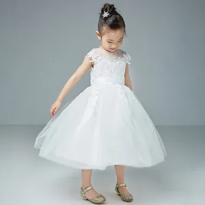 Detailed view of white floral lace bodice and sheer neckline on girl princess dress