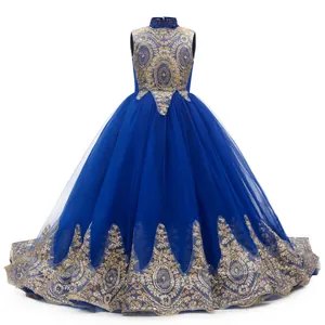 Detail of royal blue flower girl dress with gold embroidery and multilayered tulle skirt