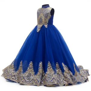 Detail of royal blue flower girl dress with gold sequin embroidery and tiered tulle