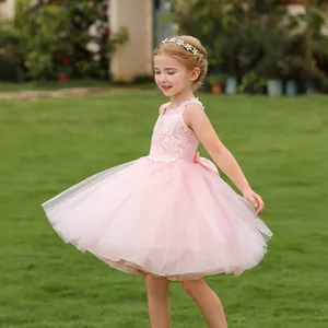 Detailed pink lace embroidery and layered tulle skirt on a girl's elegant party dress