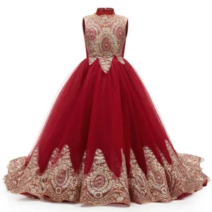 Detail of red flower girl dress featuring intricate gold embroidery and beadwork details