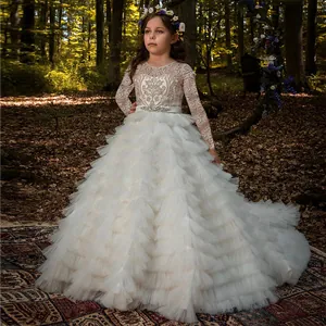Elegant white lace flower girl dress with long sleeves and tiered tulle trail skirt