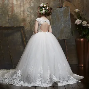 White lace flower girl dress with heart backless detail and sparkling sequin train