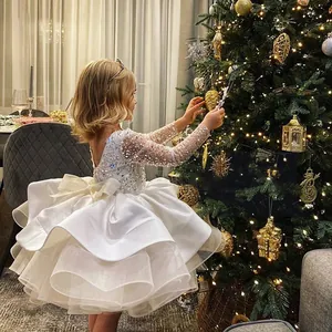 Sparkly white sequin girls' princess gown with long sleeves and layered tulle skirt