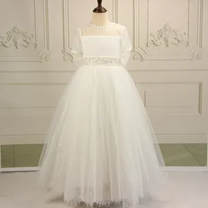 Elegant white lace flower girl dress with beaded waist belt and layered tulle princess skirt