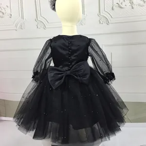 Elegant black tulle flower girl dress with beaded details and large back bow