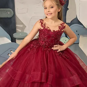 Sleeveless burgundy lace girls princess cake gown with beaded bodice and layered tulle