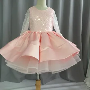 Detailed view of girls pink princess dress with sequins and multi-layer tulle skirt