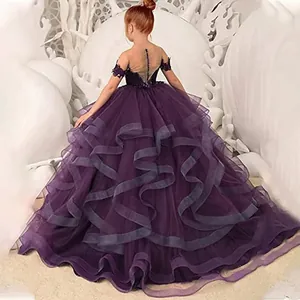 Detailed back view of dark purple girls princess dress with lace and layered tulle hem