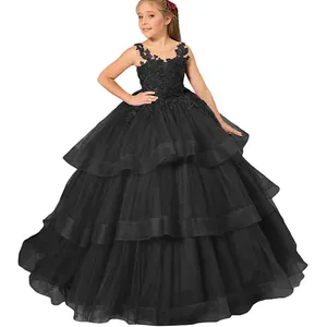 Detail of multi-layer black tulle skirt and lace embroidery on girls formal gown