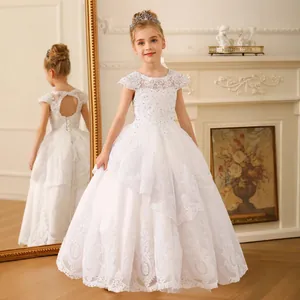 White lace flower girl dress with heart-shaped open back and intricate embroidery