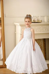 Detailed view of white floor-length lace flower girl dress with sequined beaded bodice