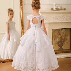 Detail of white lace flower girl dress featuring a heart-shaped hollow back and lace embroidery