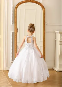 Detailed back view of white lace flower girl dress with halter neck and sequin bodice