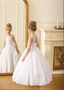 Detail of beaded halter neck and floral embroidery on white lace flower girl dress