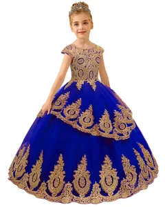 Detailed embroidery on royal blue flower girl dress with gold lace and tulle