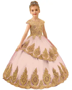 Close-up of pink flower girl dress featuring gold lace embroidery and tiered tulle skirt