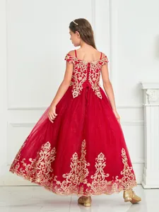 Detail of red flower girl dress with gold embroidery and lace-up back design