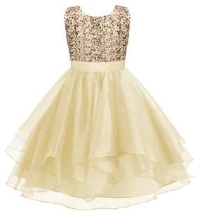 Detail of champagne flower girl dress showing sequin embroidery and layered tulle skirt