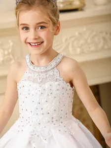Elegant white lace flower girl dress with rhinestone neckline and embroidery detail